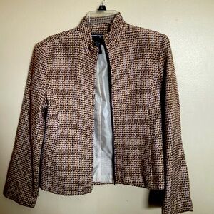 Wool lined zipper front. Touches of lavender, dark brown and tan